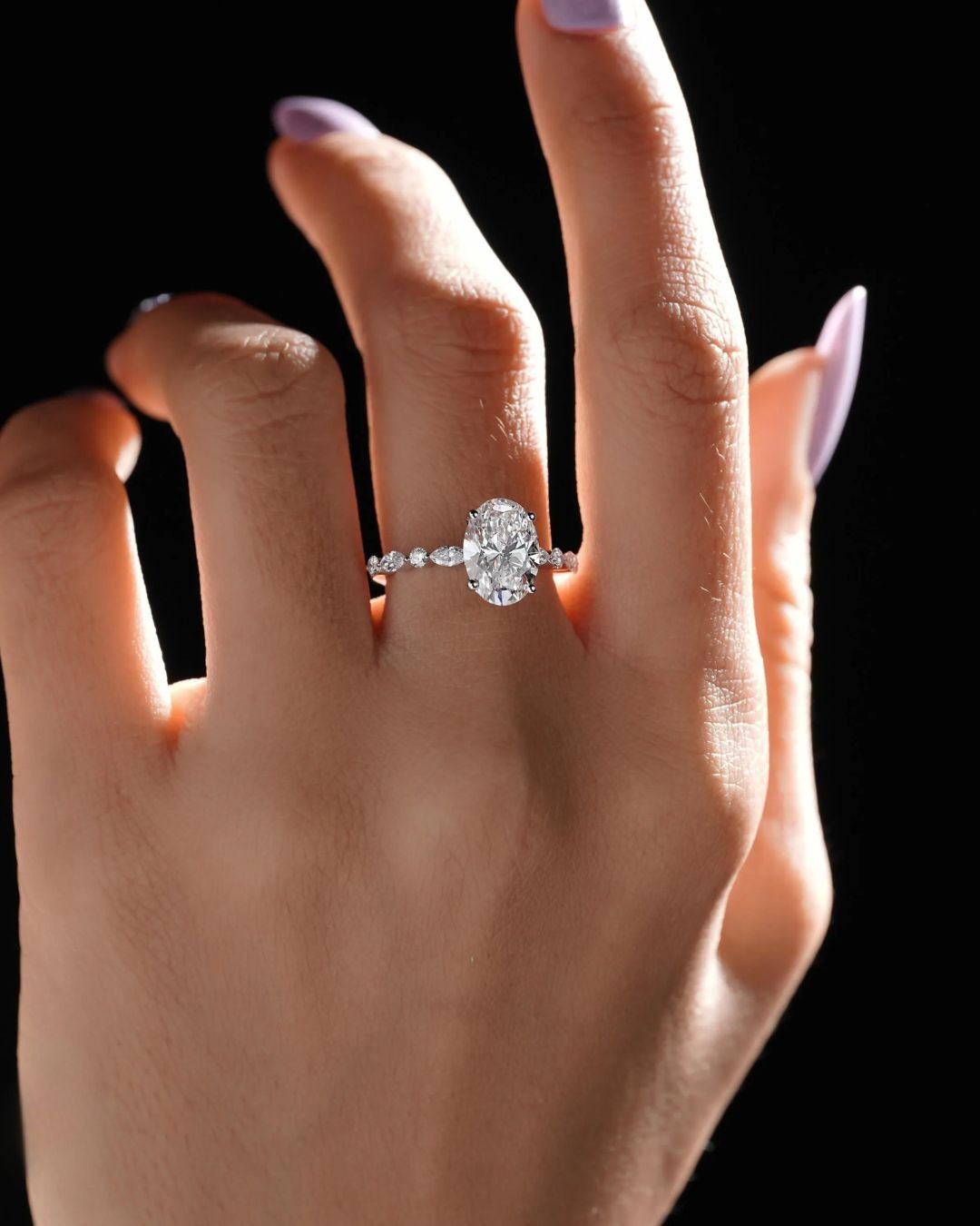 Oval Solitaire Engagement Ring With Side Stones